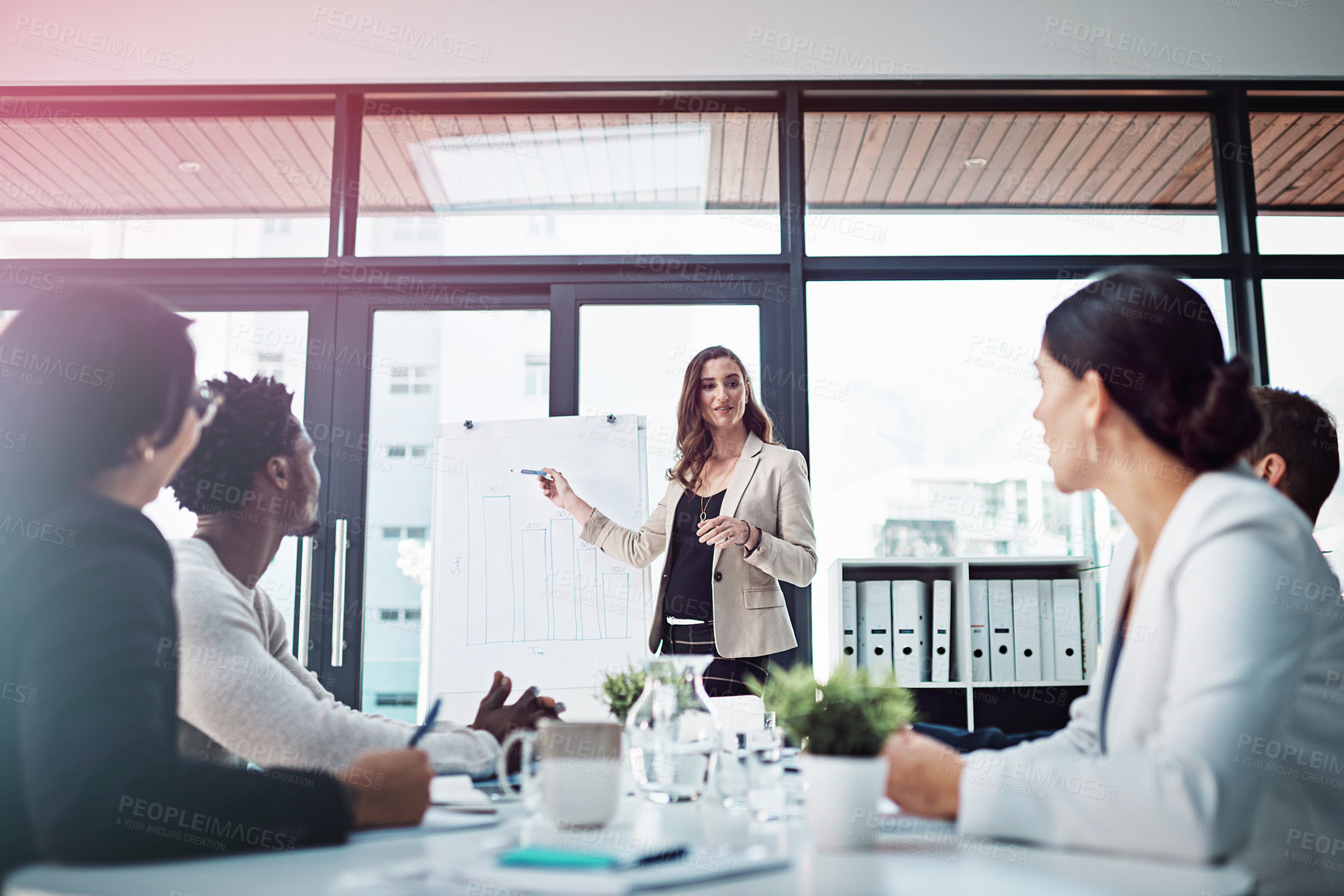 Buy stock photo Shot of businesspeople having a meeting in the boardroom