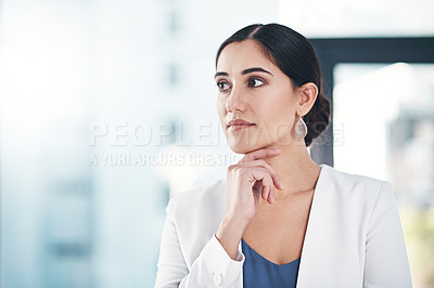Buy stock photo Shot of a successful businesswoman standing in her office