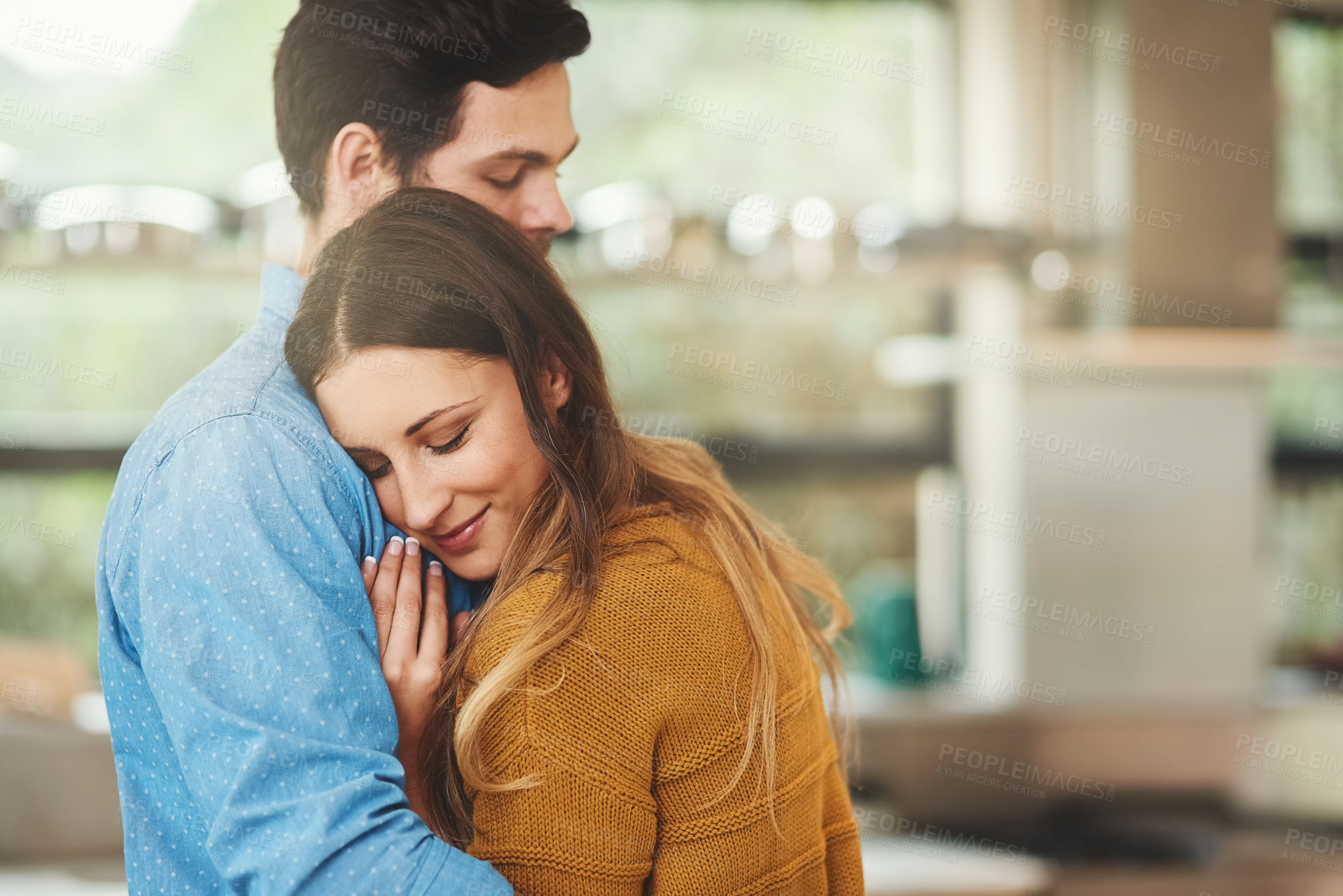 Buy stock photo Smile, bonding and couple hugging in kitchen in morning for greeting, love and care at home. Happy, romance and young man and woman embracing for sweet moment together at modern apartment in Canada.