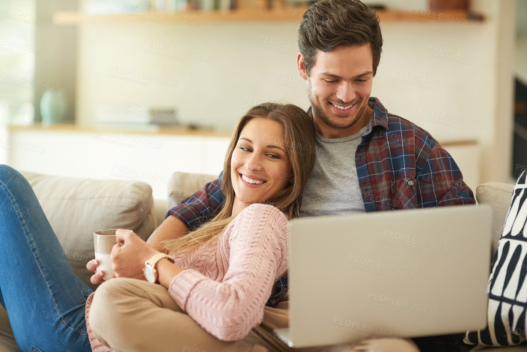 Buy stock photo Laptop, couple and sofa with love for relaxing on weekend with tech for online streaming. People, laugh and relationship in living room on internet with subscription for movie date night in house.