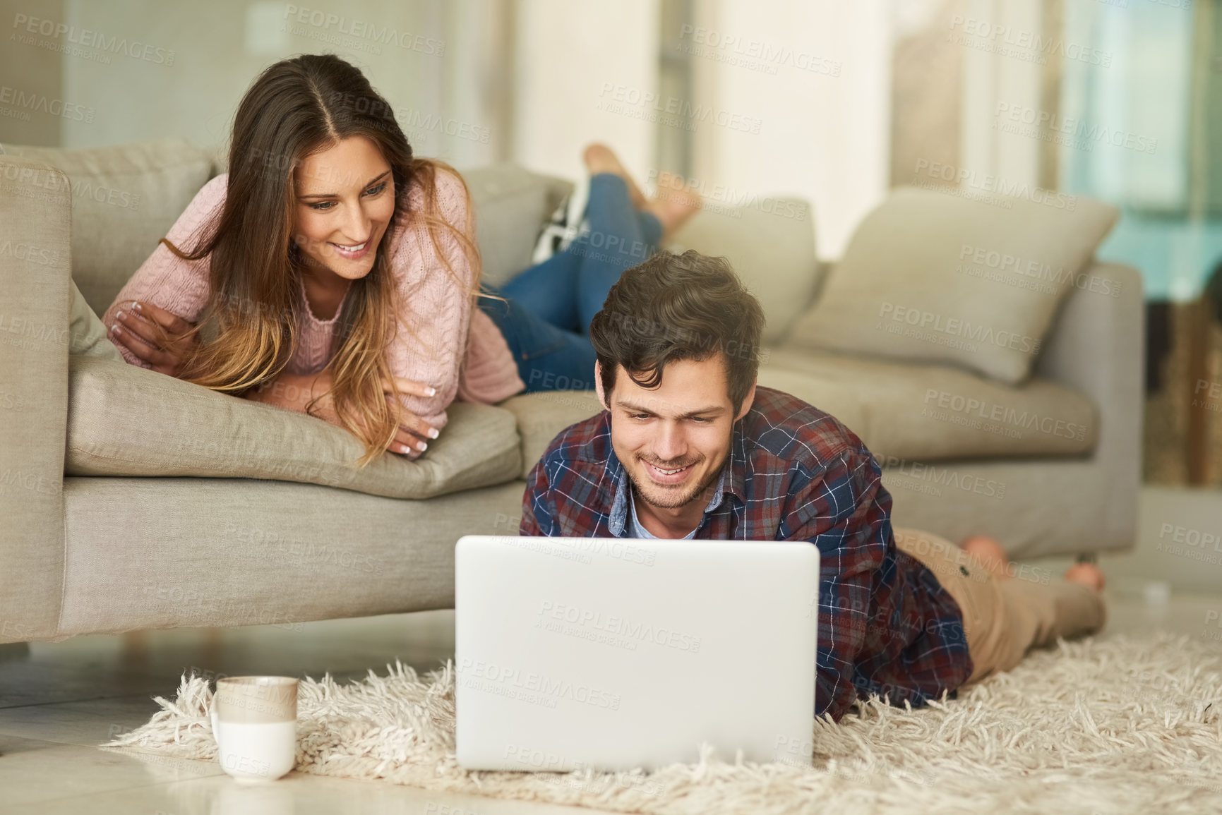 Buy stock photo Home, happy couple and laptop on carpet in living room for streaming movie, online series and comedy. Bonding, connection and people with computer for entertainment, relax and digital show in lounge