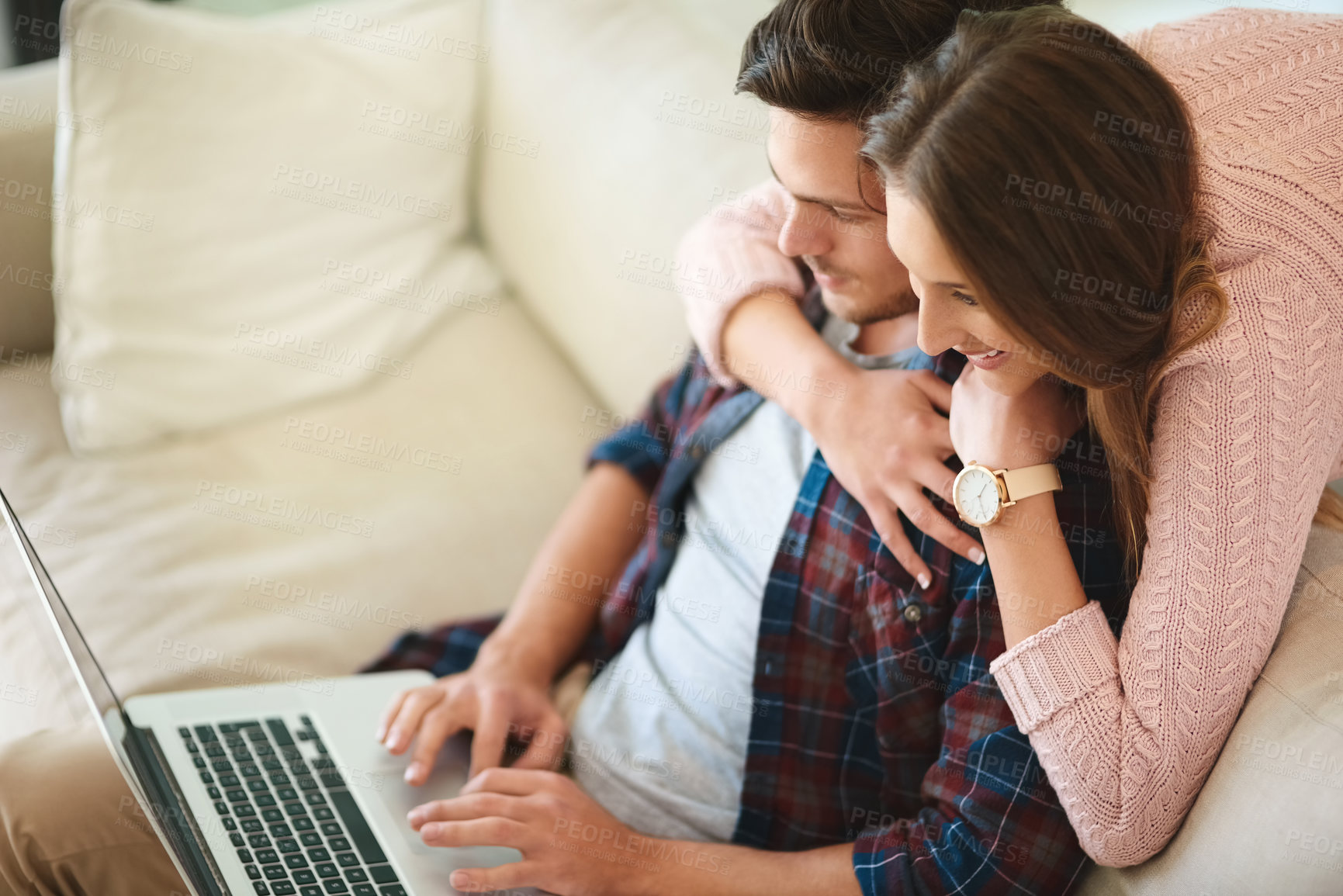 Buy stock photo Couple, hug and laptop in house on sofa for movie, film and online streaming. Man, woman and technology with smile in home living room on couch for social media, internet and website subscription