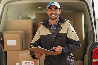 Buy stock photo Portrait of a smiling delivery man standing in front of his van holding a package