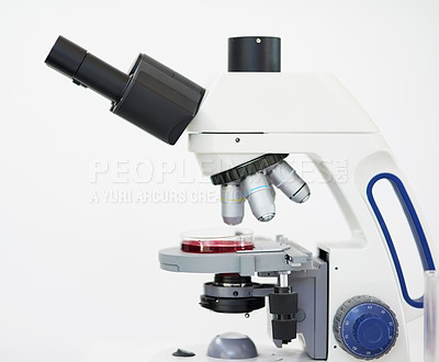 Buy stock photo Closeup shot of a microscope against a white background