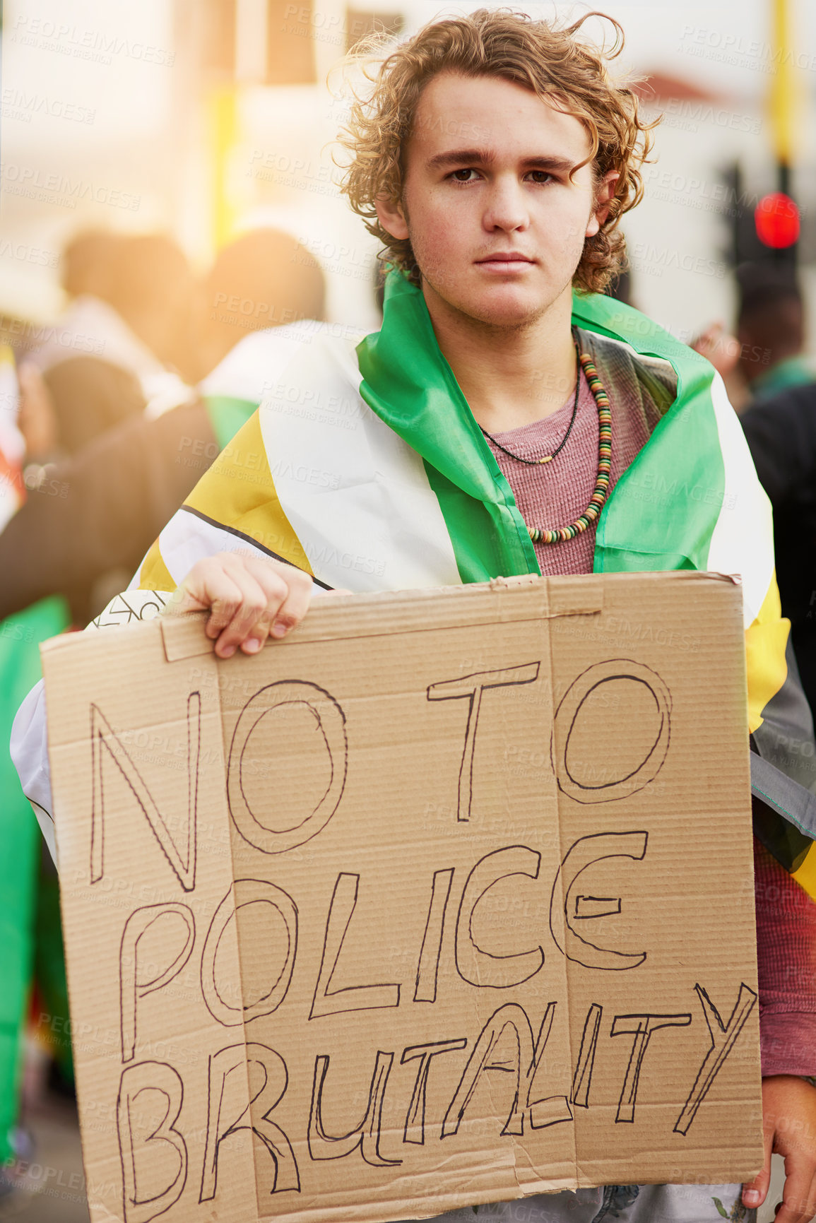 Buy stock photo Portrait of a young protester holding a anti police brutality sign at a rally