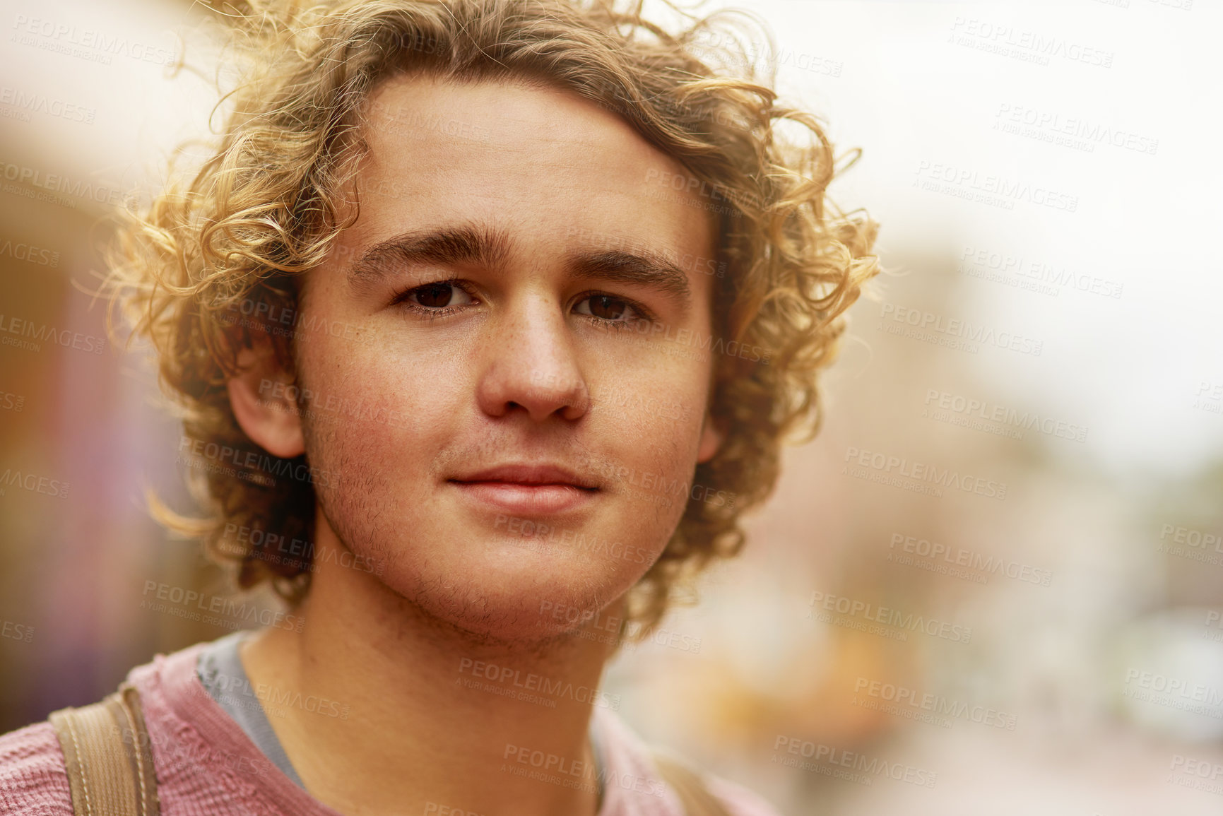 Buy stock photo Portrait of a young man standing in a city street