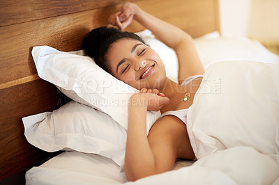 Buy stock photo Morning, calm and woman in bed with stretching, wake up and happiness after sleeping or resting. Relax, peace and comfort of female person in bedroom for feeling fresh, health and smile at home