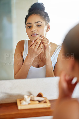 Buy stock photo Skincare, mirror and woman popping pimple on face with hands, dirt or scar on skin in home. Dermatology, facial wellness and girl in bathroom to squeeze acne, checking reflection or morning routine