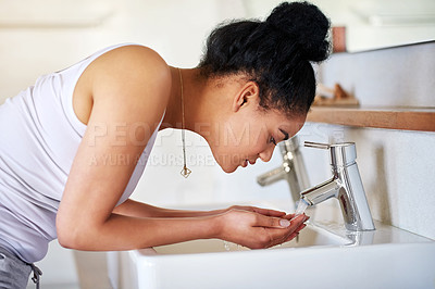 Buy stock photo Woman, bathroom and tap for washing face, skincare and beauty for morning routine or wellness in home. Female person, sink or girl cleaning with water in house for natural facial treatment in basin