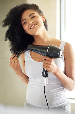 Buy stock photo Woman, bathroom and heat dryer for hair, hairstyle and electric appliance for haircare in home. Female person, grooming and tool for treatment, curly afro and reflection in mirror for cosmetics