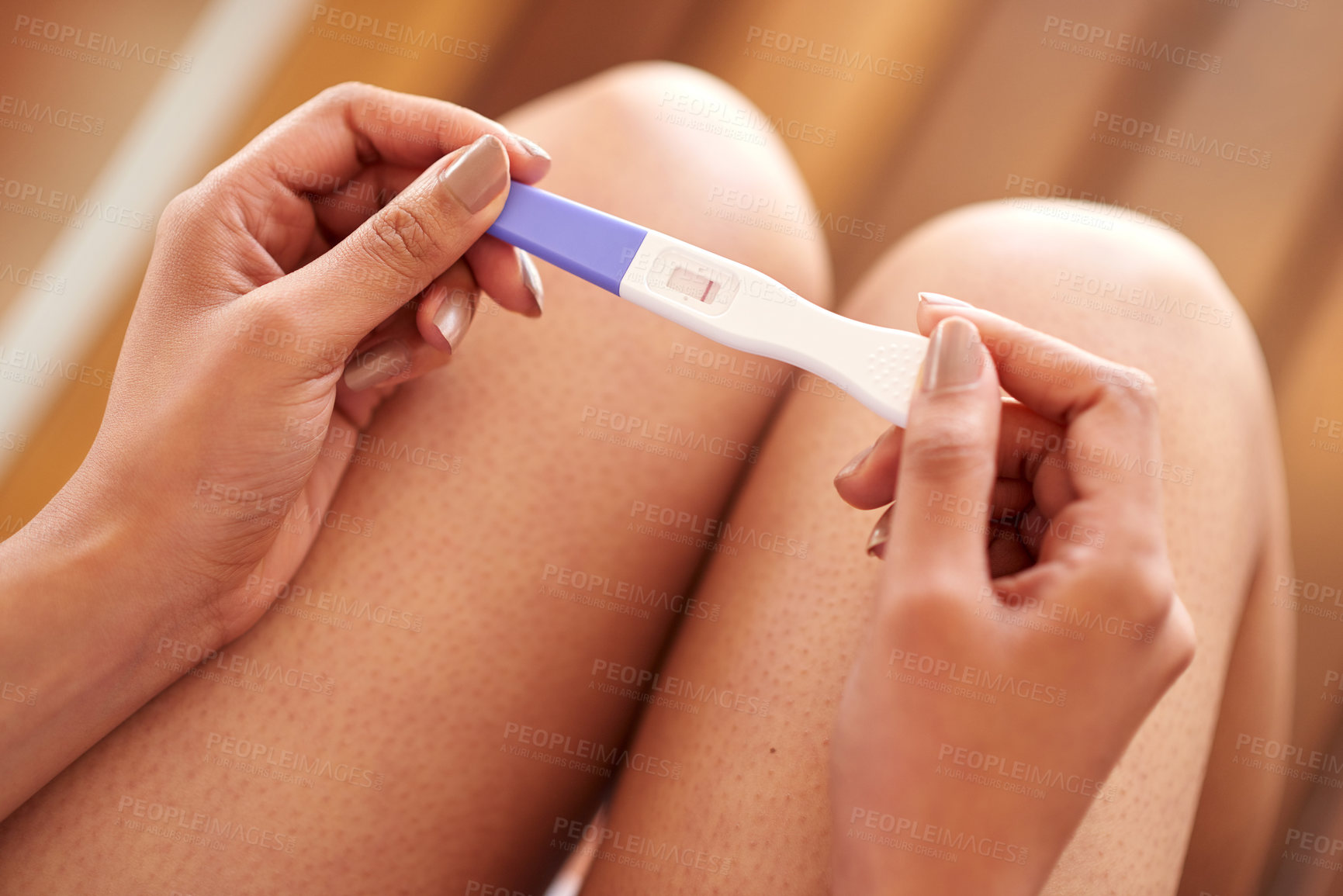 Buy stock photo Woman, hands and pregnancy test with negative results of line, stick or examination at home. Closeup of female person waiting in motherhood with maternity exam for impregnation sign or expectation