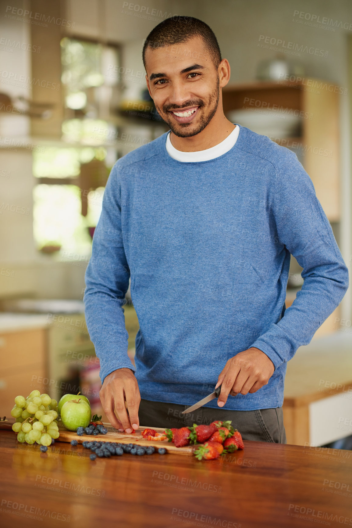 Buy stock photo Cooking, fruit and portrait of man in kitchen of home for diet, health or nutrition on weekend. Food, ingredients and recipe with happy person in apartment for organic meal preparation or wellness