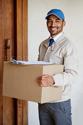 Buy stock photo Portrait of a friendly delivery man delivering a box to a customer's door