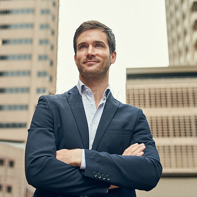 Buy stock photo Cropped shot of a confident young businessman out in the city