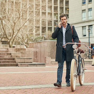 Buy stock photo Portrait of a young businessman commuting to work with his bicycle