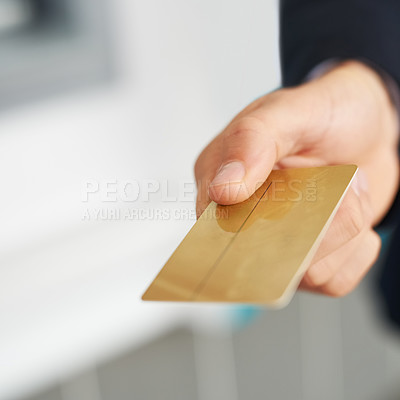 Buy stock photo Closeup shot of an unidentifiable businessman holding out a credit card