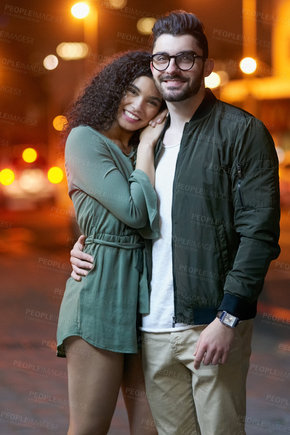 Buy stock photo Portrait of a happy young couple outdoors at night