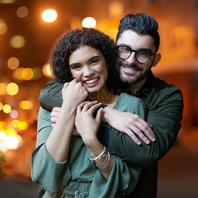 Buy stock photo Portrait, night and happy couple with hug for love, dating and relationship with support and romance. Outdoor, man and woman for embrace with smile, evening walk together and partnership with trust