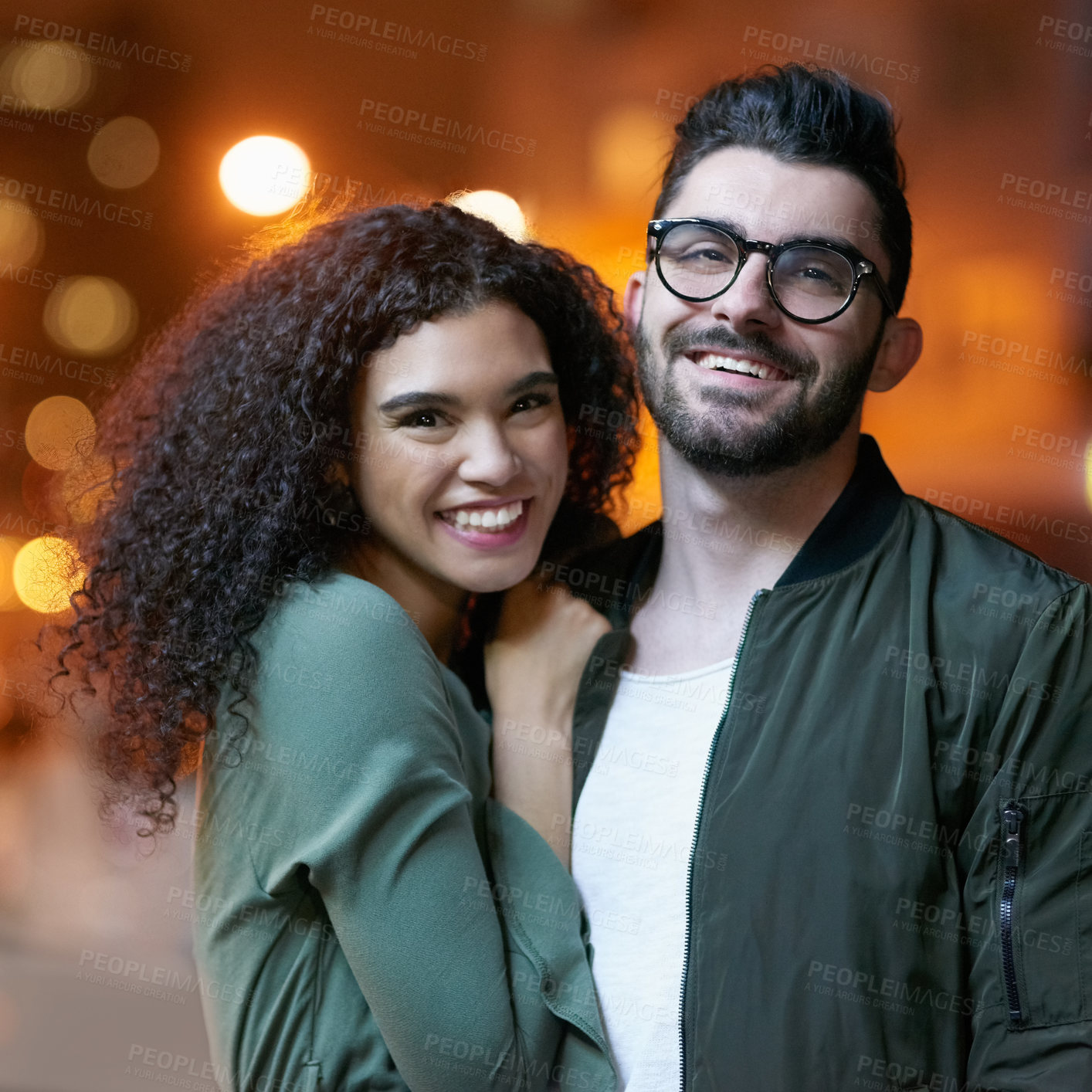 Buy stock photo Couple, love and night with light in urban city, portrait and body for holiday or honeymoon. Smile, hug and affection for diversity with man and female person, married and travel to New York for date