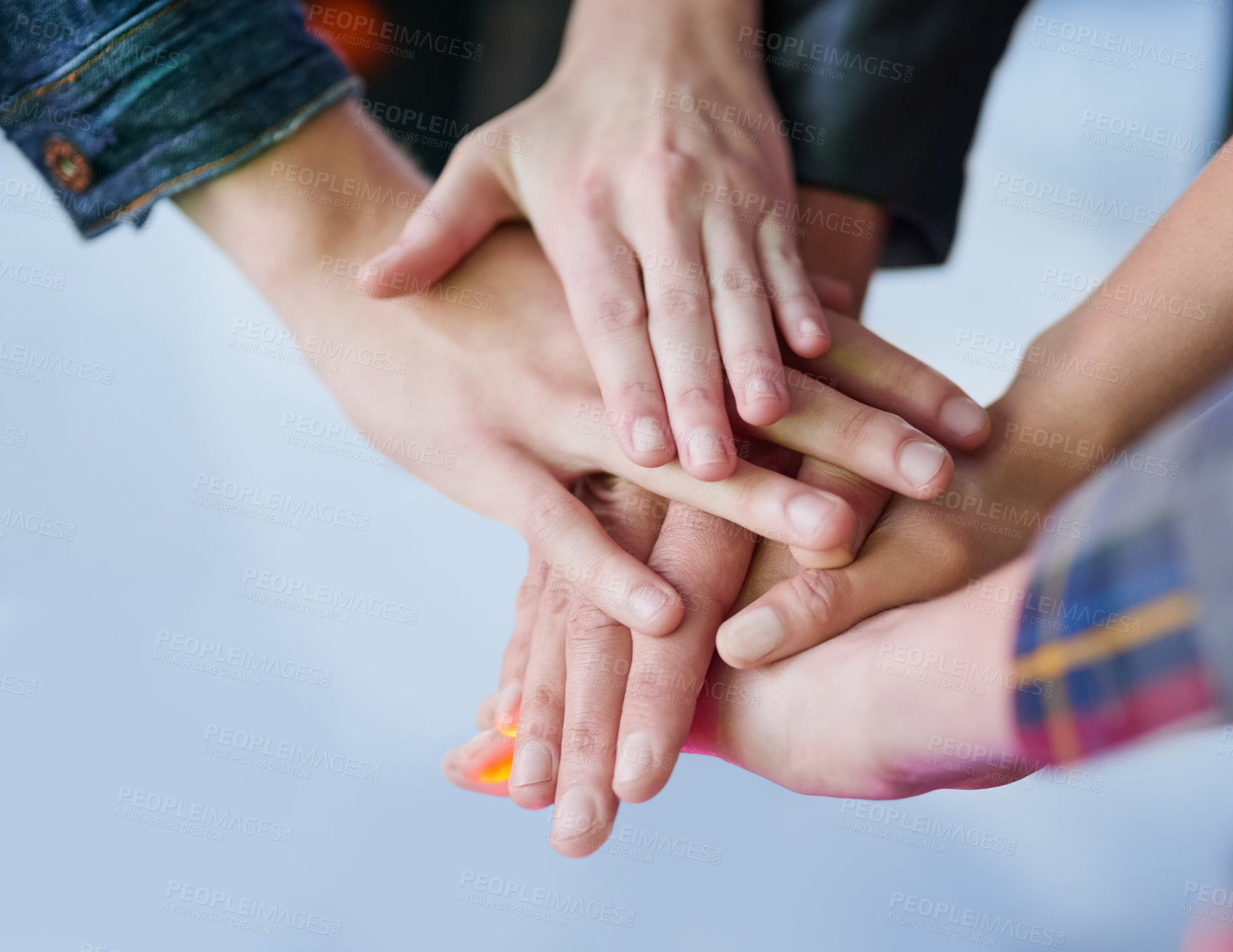 Buy stock photo Shot of a group of unidentifiable friends making a pact by putting their hands in a pile