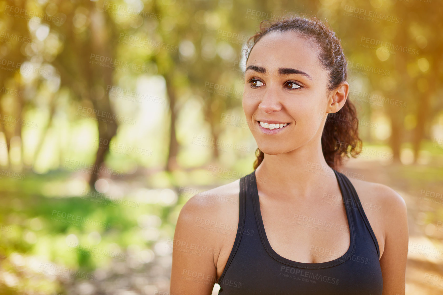 Buy stock photo Woman, athlete and happy in nature for exercise, run and fitness outdoor with smile in summer. Female runner, sports and training in park for cardio, race and endurance with happiness in sunshine