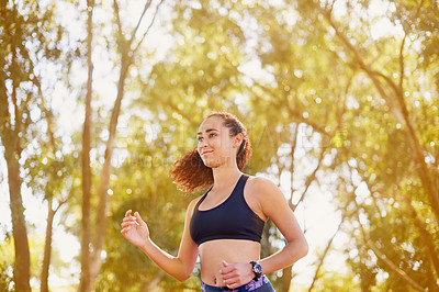 Buy stock photo Running, fitness and woman in a park for exercise, health or marathon training with morning cardio in nature. Wellness, smile and girl runner in Canada for sports run, workout or energy performance