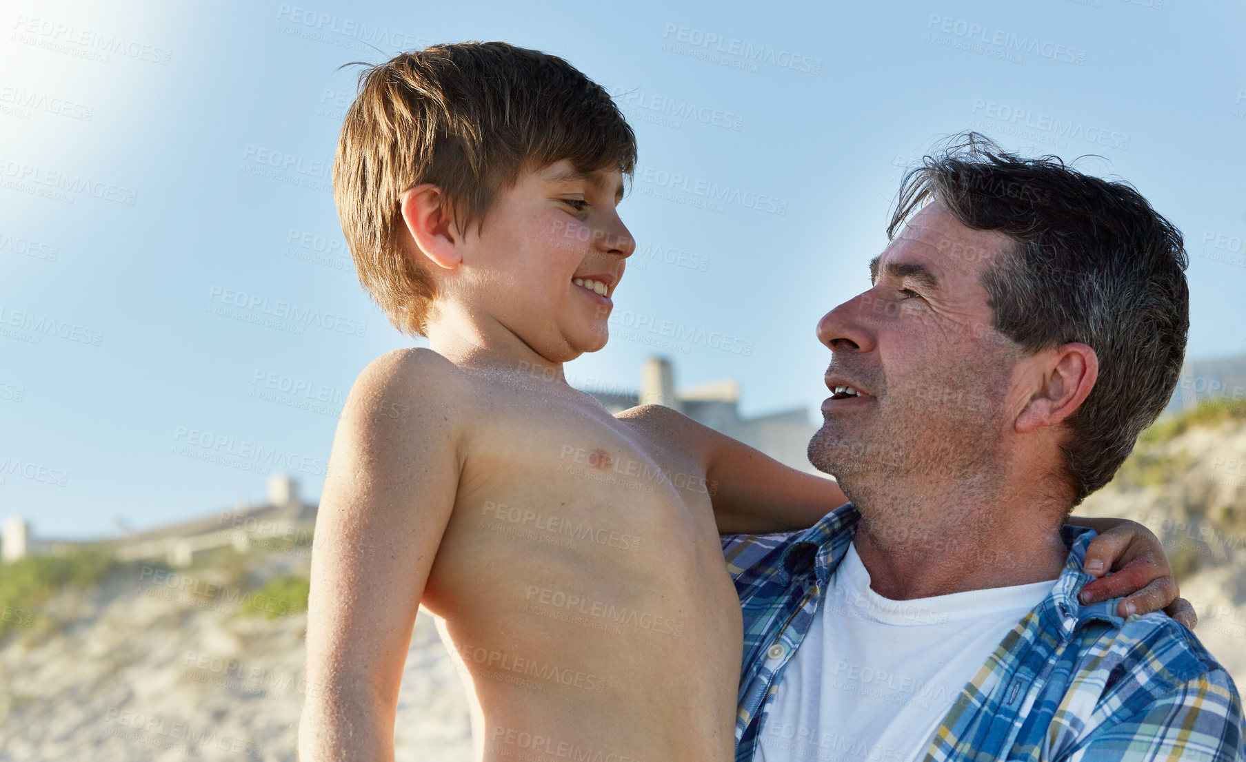 Buy stock photo Hug, beach and father with son, vacation and bonding together with tropical island getaway and cheerful. Weekend break, embrace or family with seaside holiday and summer with love, travel or sunshine
