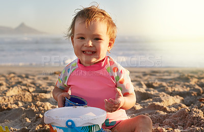 Buy stock photo Portrait of an adorable little girl playing in the sand at the beach