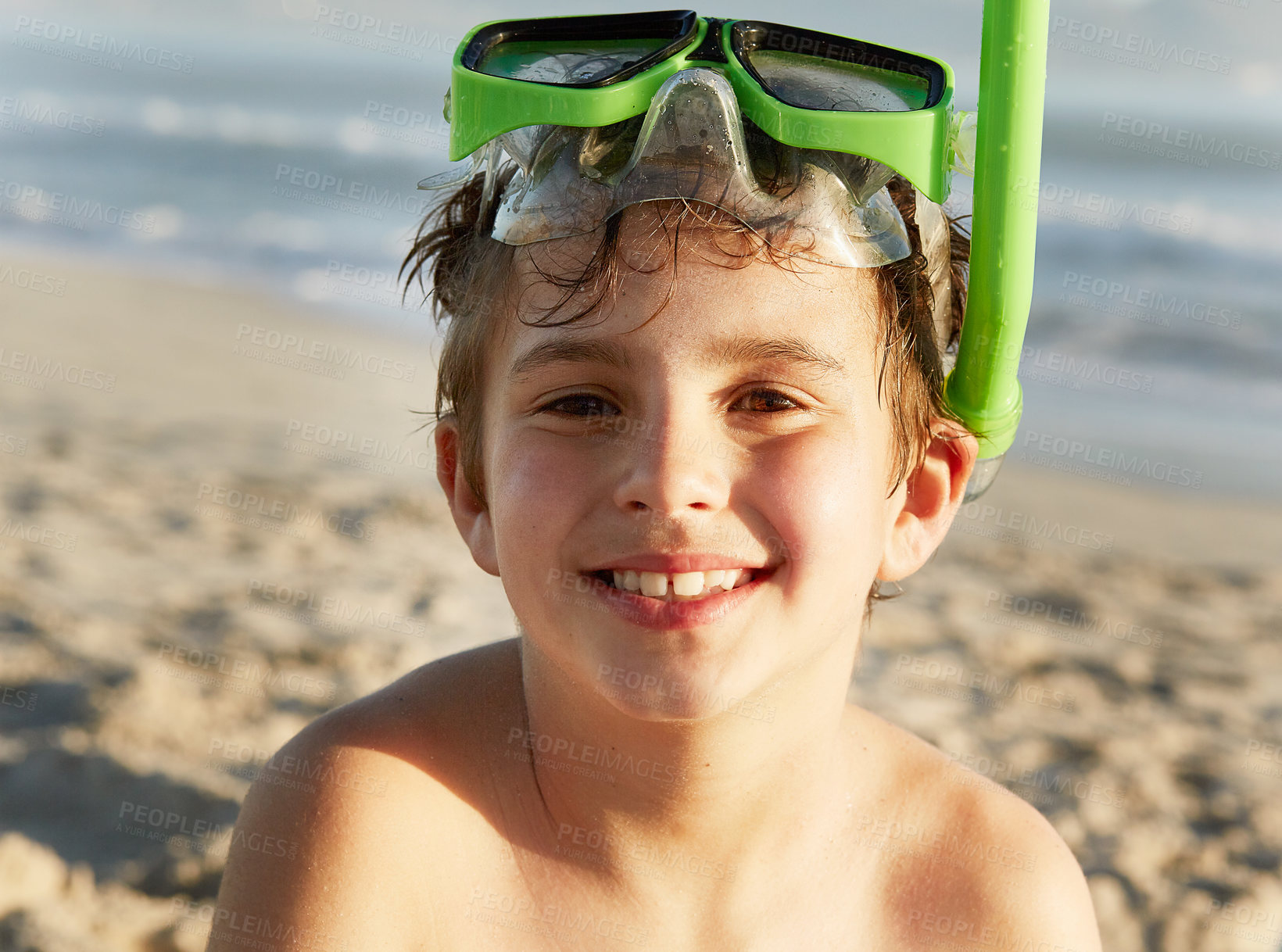 Buy stock photo Portrait, smile and boy with snorkel on beach by ocean on holiday or vacation in summer. Face, kids and sea with happy young child in mask on sand by water for swimming, travel or weekend getaway