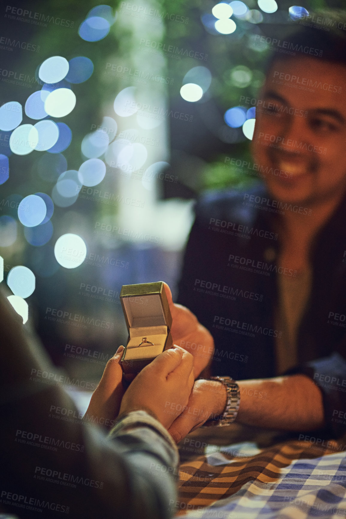 Buy stock photo Date, ring and man with engagement and couple at restaurant for marriage question and celebration with love. Bokeh, dinner and romance with proposal with people at night at table with smile and box