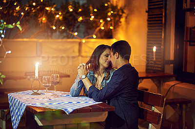 Buy stock photo Shot of an affectionate couple out on a romantic date