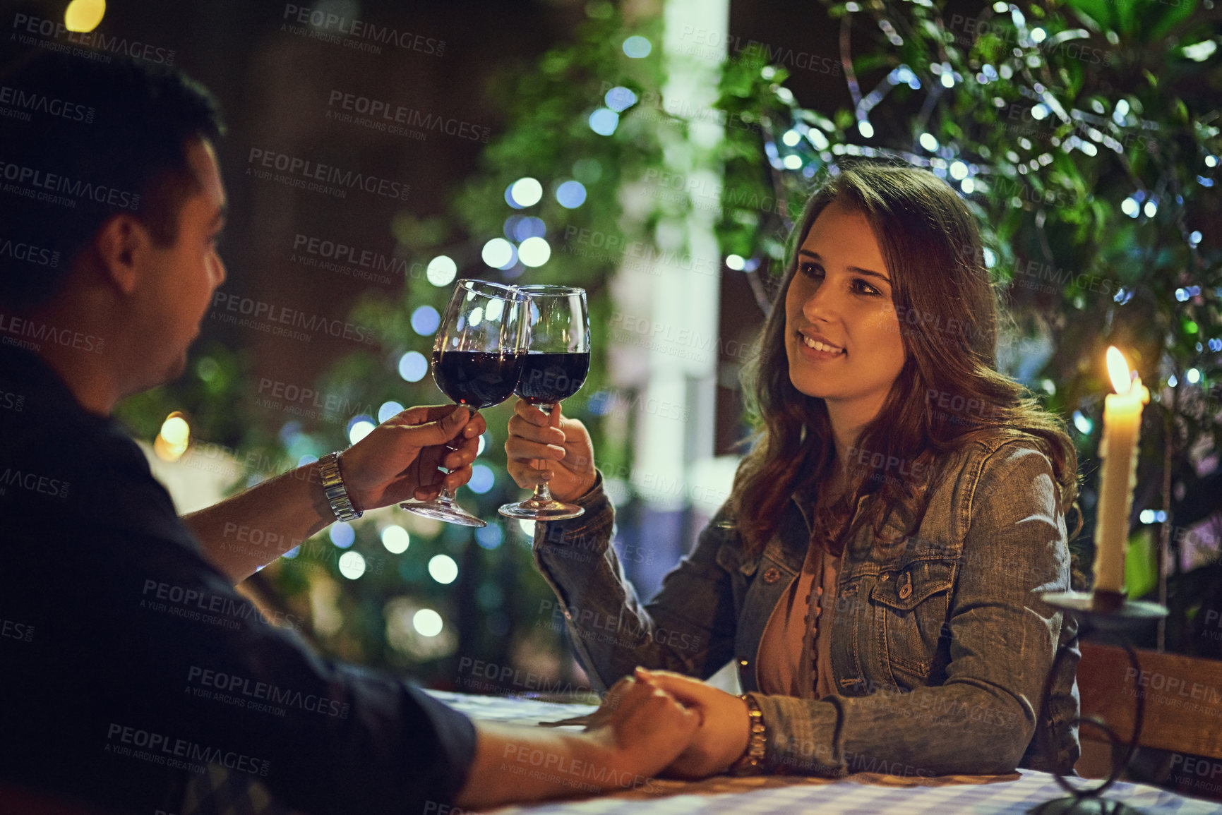 Buy stock photo Couple, night and restaurant for date, engagement and love for romance or celebration. Woman, man and wine for marriage, commitment and proposal for future together with outdoor fine dining ambience