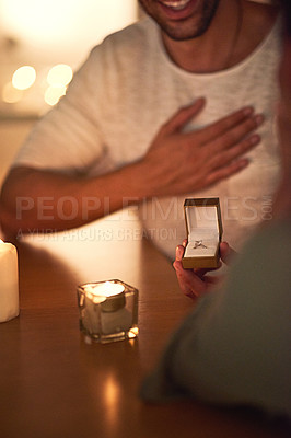 Buy stock photo Cropped shot of a young man asking his girlfriend's hand in marriage