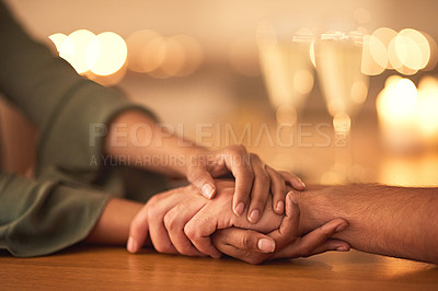 Buy stock photo Cropped shot of two people holding hands in comfort