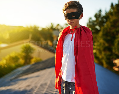 Buy stock photo Portrait of a young boy in a cape and mask playing superhero outside