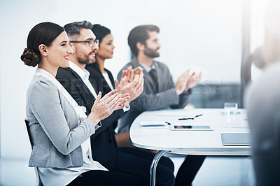 Buy stock photo Shot of a group of businesspeople applauding during a meeting in the boardroom