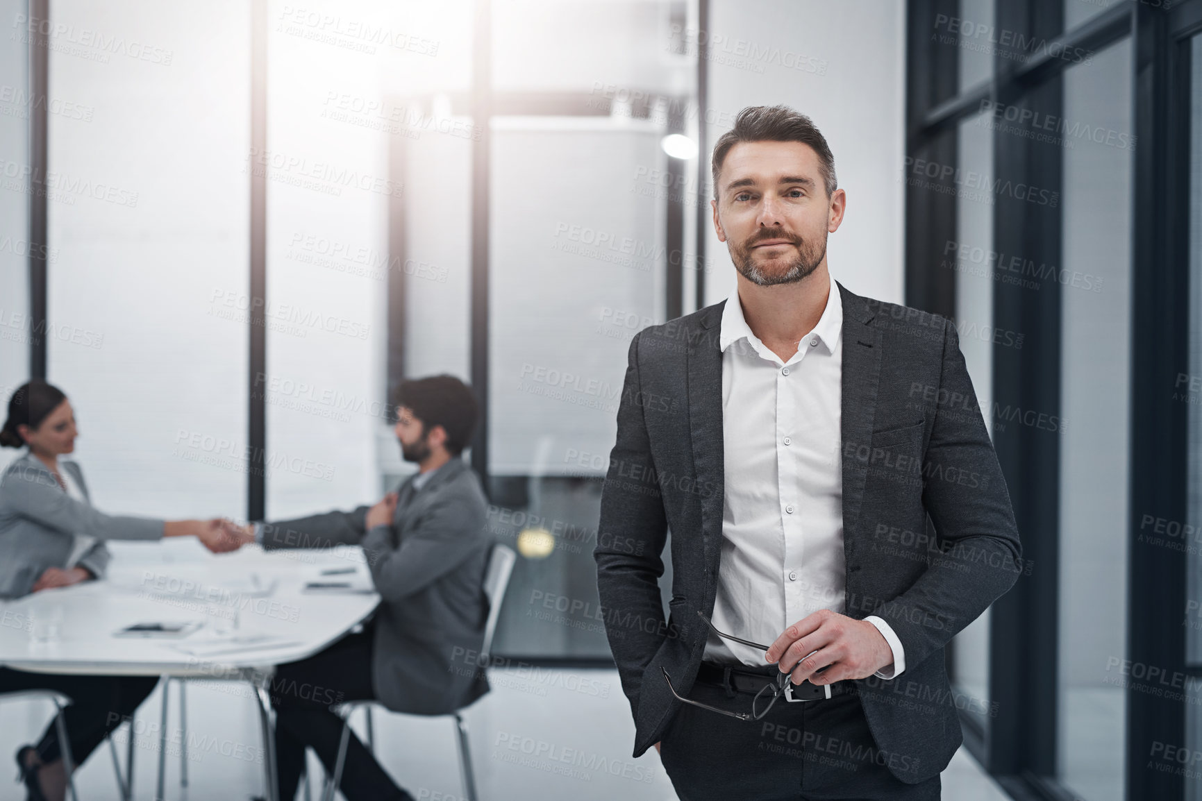 Buy stock photo Businessman, executive and portrait in office with meeting or handshake for recruitment, agreement and face of company. Man, ceo and professional with international business growth of legal firm. 