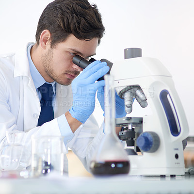 Buy stock photo Science, exam and man with microscope in lab for vaccine study, dna test or medical experiment. Scientist, research and investigation with biotechnology for stem cell, innovation and development