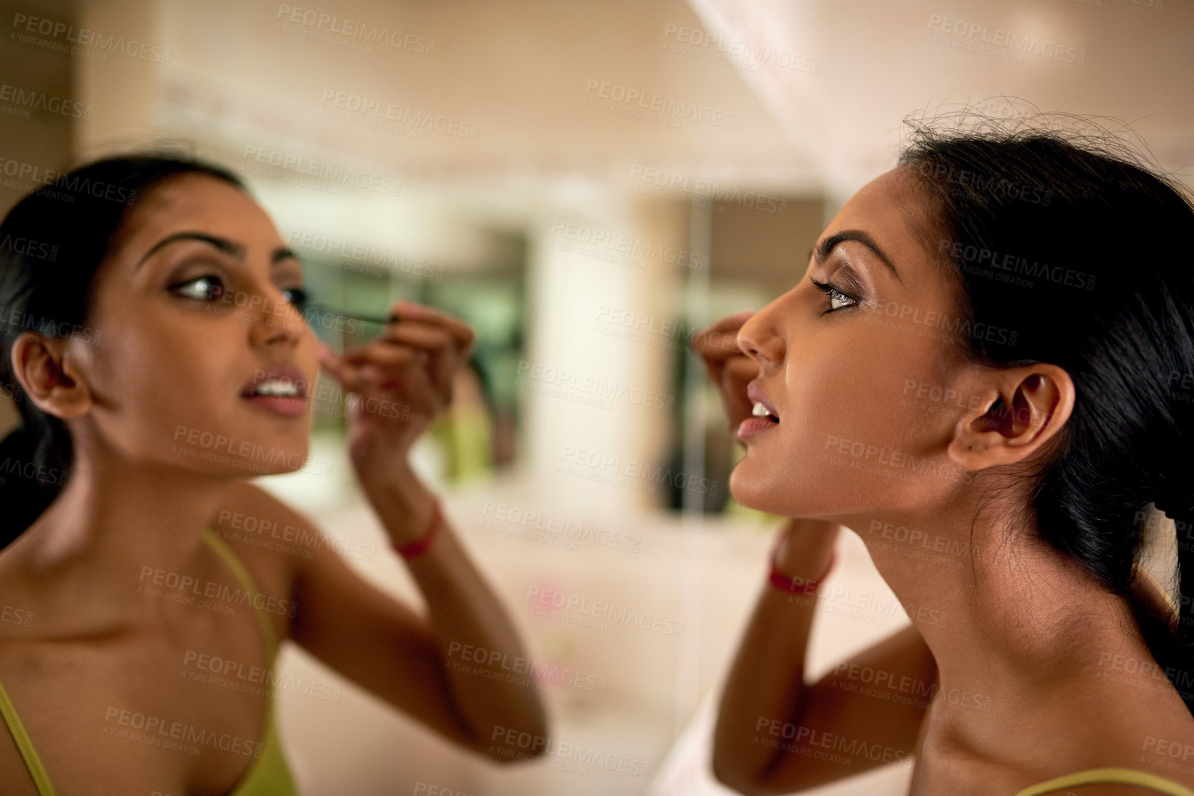 Buy stock photo Woman, mirror and makeup for cosmetic and mascara, beauty and product on face in bathroom of home. Eyelashes, cosmetology and selfcare for Indian female person, grooming and brush for application