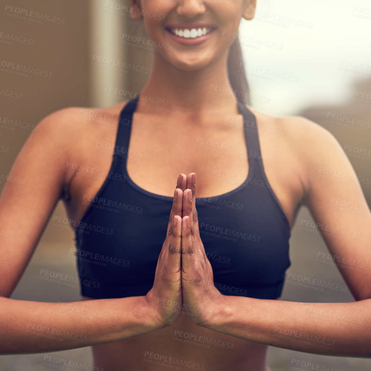 Buy stock photo Cropped shot of a beautiful young woman practising yoga outdoors