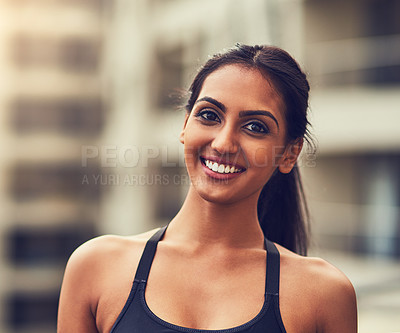 Buy stock photo Shot of a beautiful young woman exercising outdoors