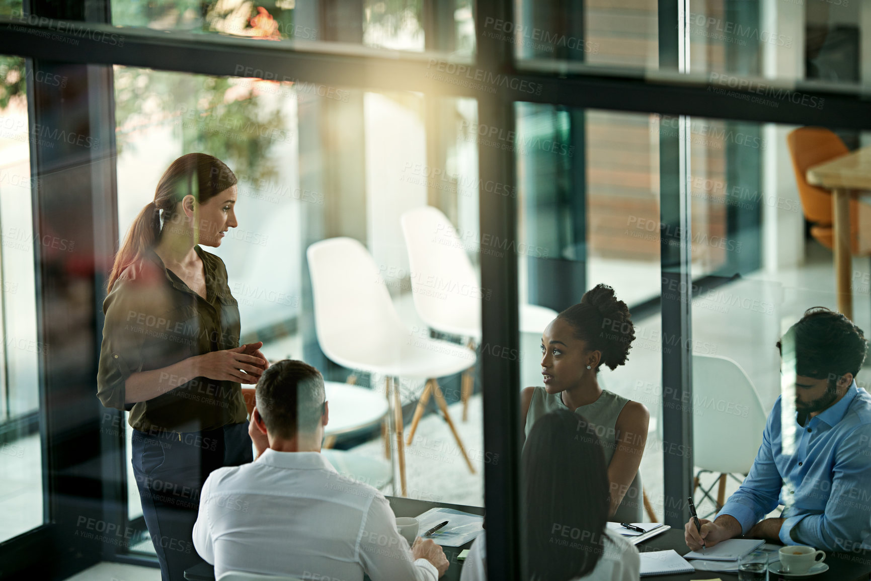 Buy stock photo Boardroom, speaker and woman in presentation, talking and  group of colleagues, listening and together. Workshop, training and employees in business, journalist and notes for meeting or collaboration