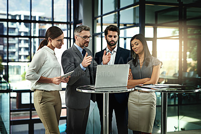 Buy stock photo Shot of a group of businesspeople meeting in the office