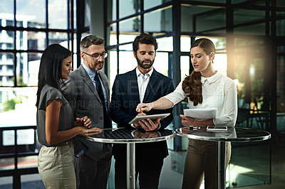 Buy stock photo Shot of a group of businesspeople meeting in the office