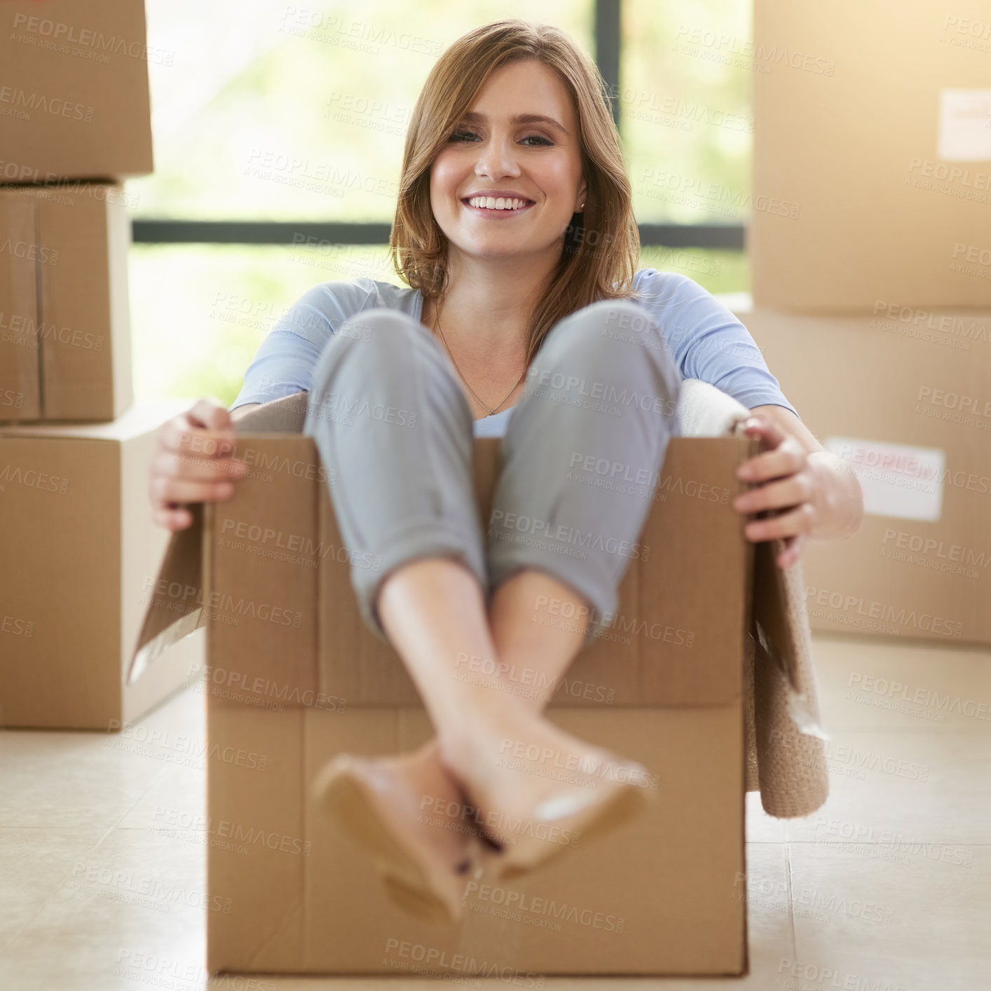 Buy stock photo Portrait, boxes and home with woman, silly and happiness with real estate, achievement and life goals. Person, apartment and girl in cardboard, funny and playful with joy, mortgage and property owner