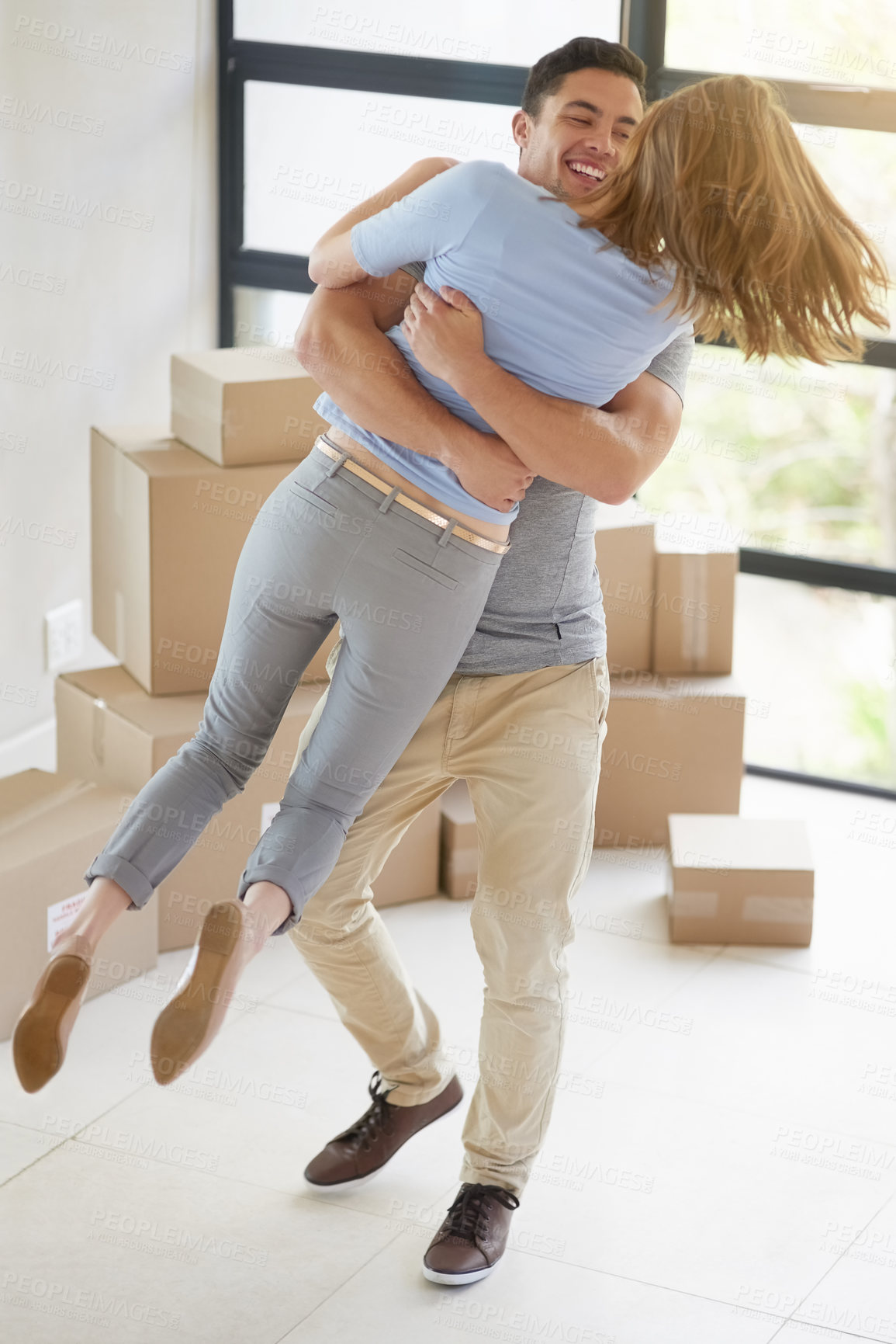 Buy stock photo Couple, celebration and moving to new home, hug and property success or investment home loan. People, boxes and rent or buy apartment for achievement, relocation and purchase for real estate dream