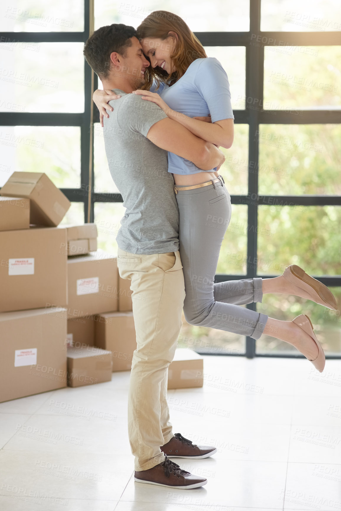 Buy stock photo Couple, boxes and moving to new home, embrace and property success or investment home loan. People, cardboard and hug or rent apartment for achievement, relocation and purchase for real estate dream