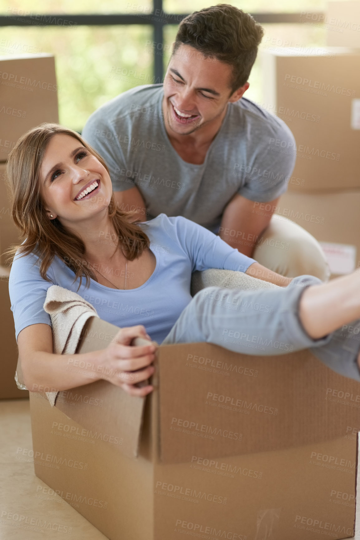 Buy stock photo Happiness, couple or moving with boxes in new home for real estate, playing or together for growth. Man, house or woman in cardboard with smile for investment in future, property with mortgage in USA