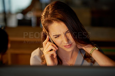 Buy stock photo Shot of an attractive young businesswoman rubbing her neck in pain while rubbing her neck in the office
