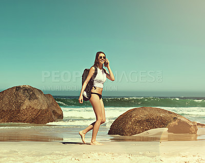 Buy stock photo Shot of a backpacker enjoying a day at the beach